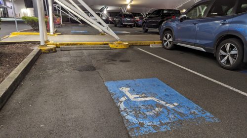 Disabled parking bay with no access to walkway