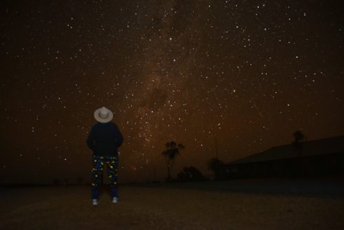 Ann looking at the stars in the night sky.