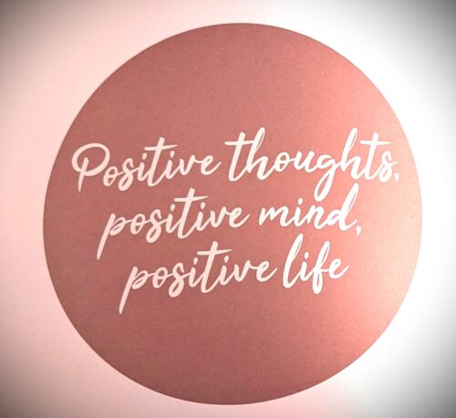 Pink circle with words in it that say positive thoughts, positive mind, positive life